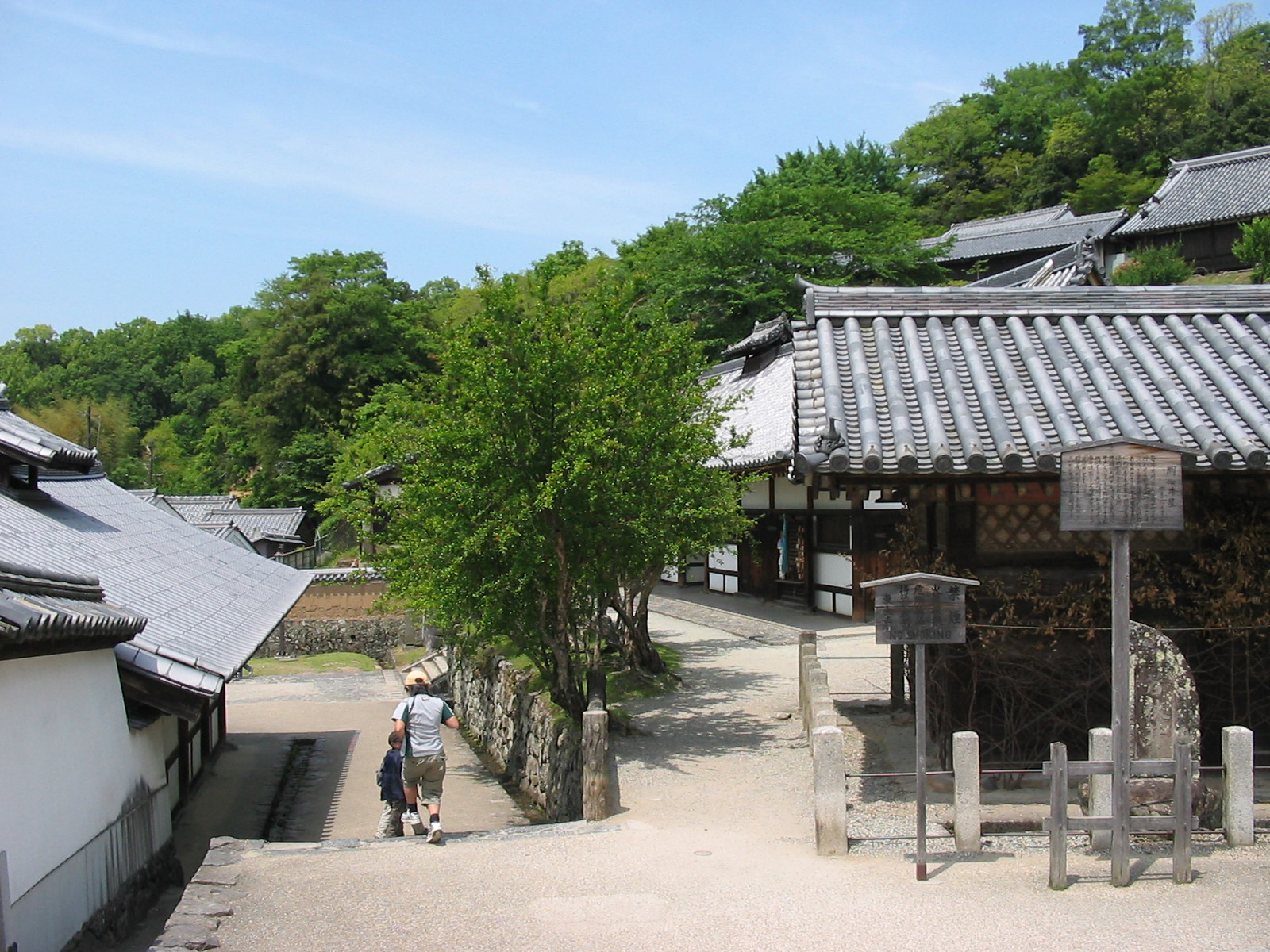 a series of buildings with people walking down stairs