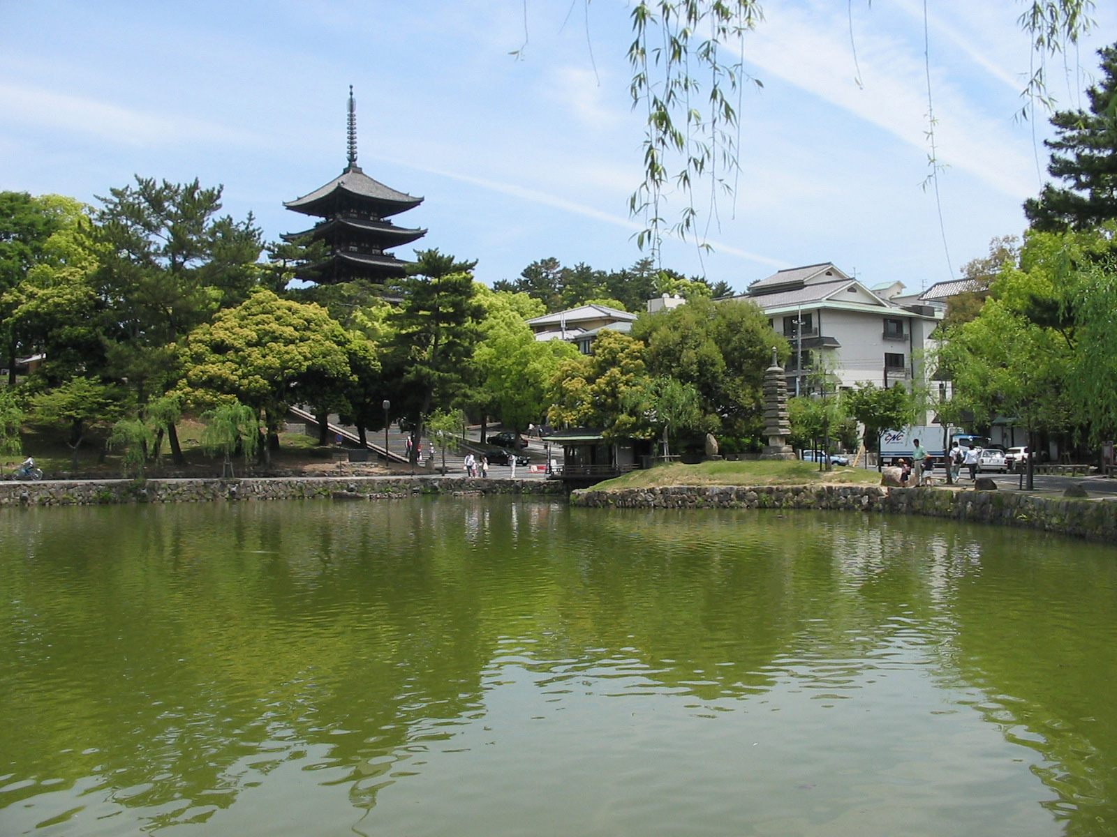 pond with temple building in the background