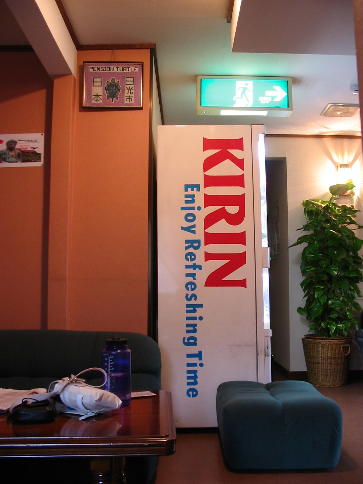 vending machine in lobby of hotel with the slogan 'Kirin, enjoy refreshing time'