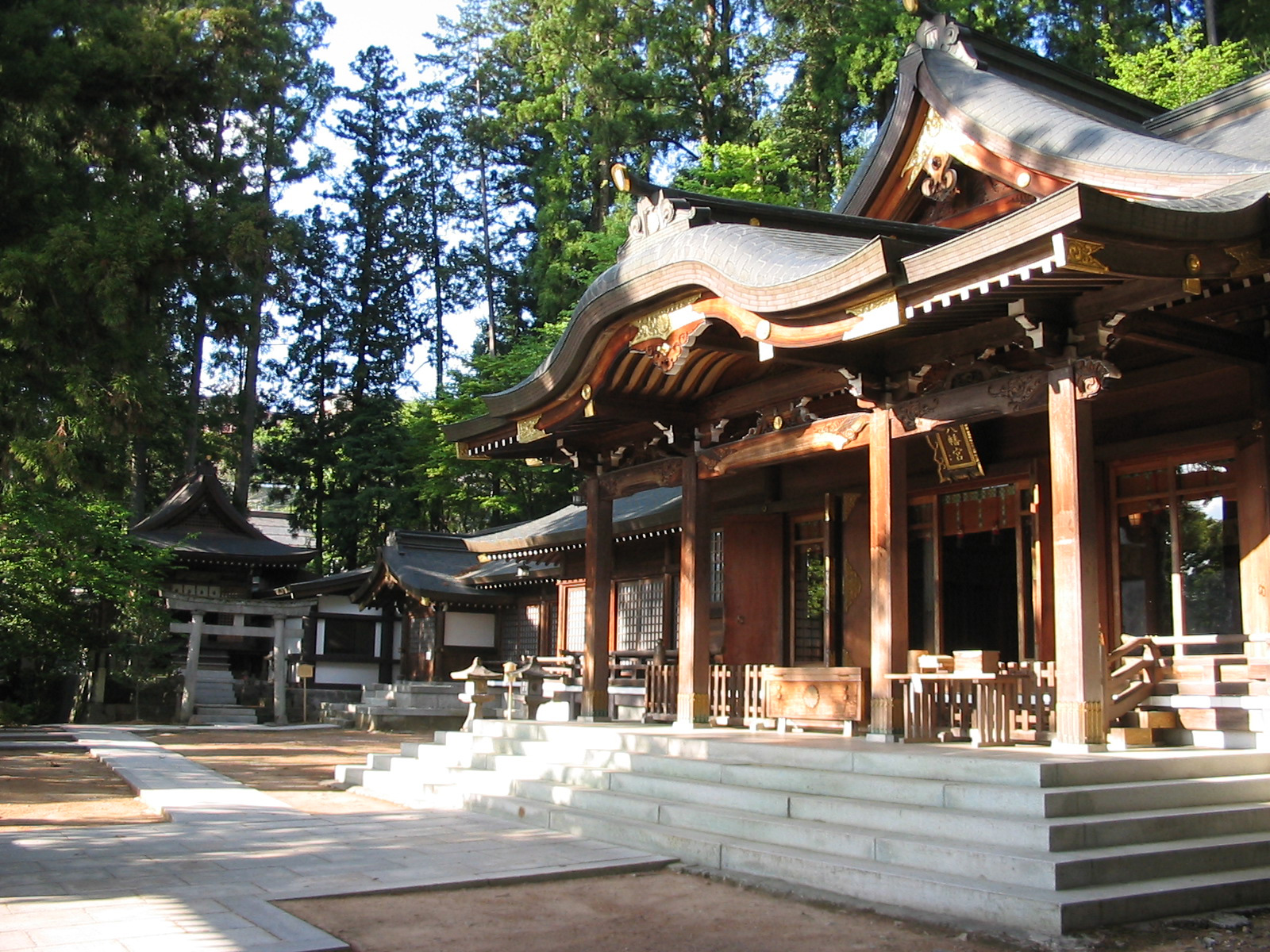 shrine pavillion surrounded by trees