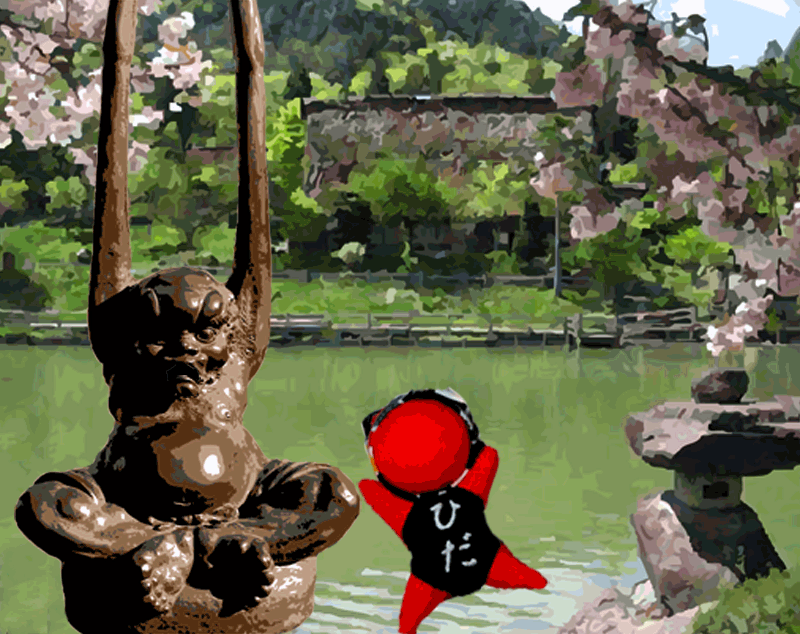 village with cherry blossoms in the background. statue of old man with dancing red doll in the foreground